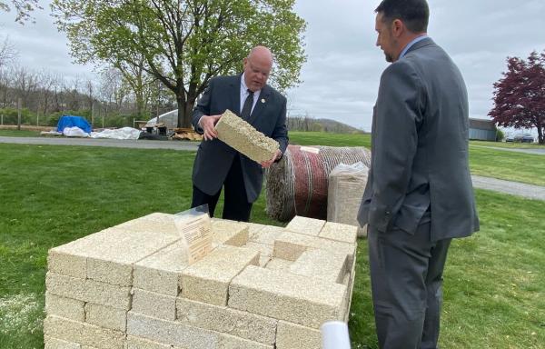 State Director for Rural Development in Pennsylvania inspects a Hemp Block at Alvernia University.